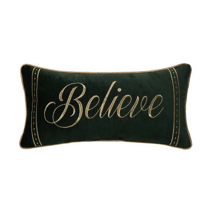 A 10in. x 20in. Gold Believe Pillow.