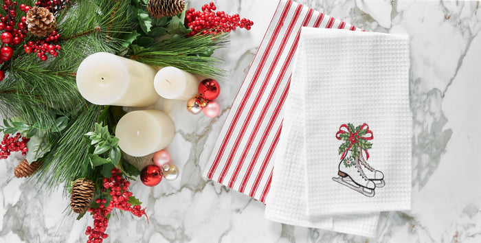 A Skates and Holly Waffle Weave Kitchen Towel.