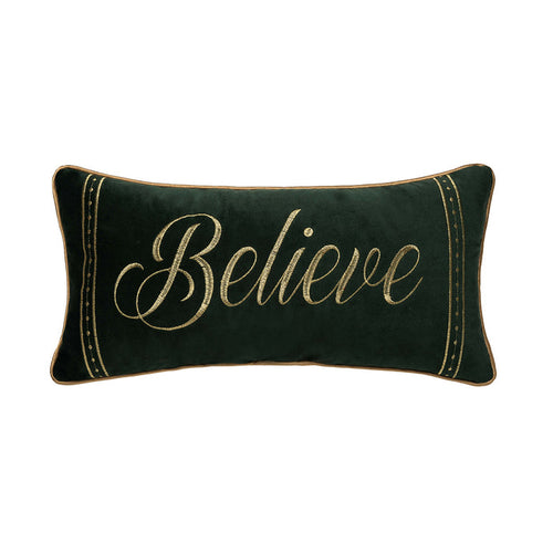 A 10in. x 20in. Gold Believe Pillow.