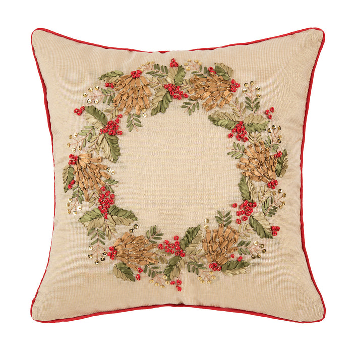 A 18in. x 18in. Merry Wreath Pillow.