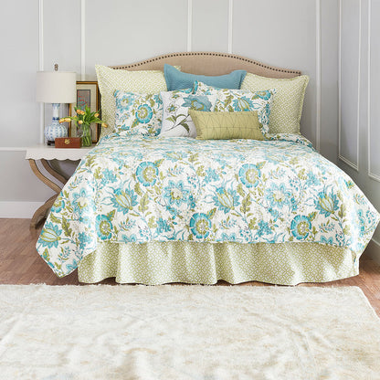A Adrienne Quilt displayed on a made bed.