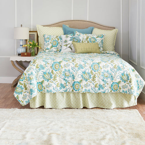 A Adrienne Quilt displayed on a made bed.