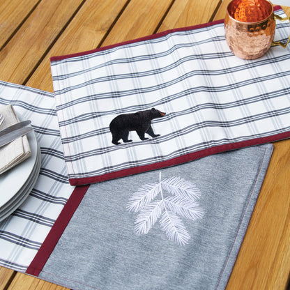 Bear Lodge Outdoor Table Linens table linens displayed as a coordinated tabletop setting.