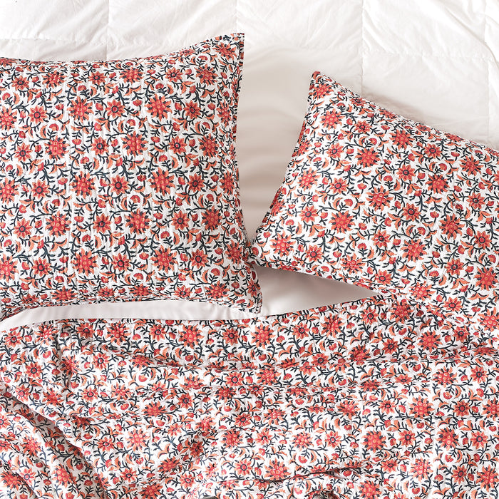 A Colley Quilt displayed on a made bed.