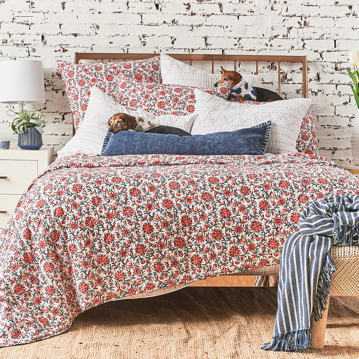 A Colley Quilt displayed on a made bed.