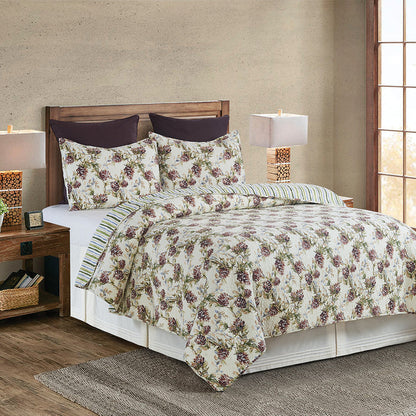 A Cooper Pines Quilt Set displayed on a made bed.