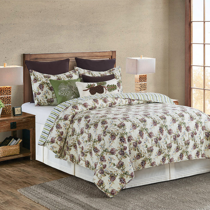 A Cooper Pines Quilt Set displayed on a made bed.
