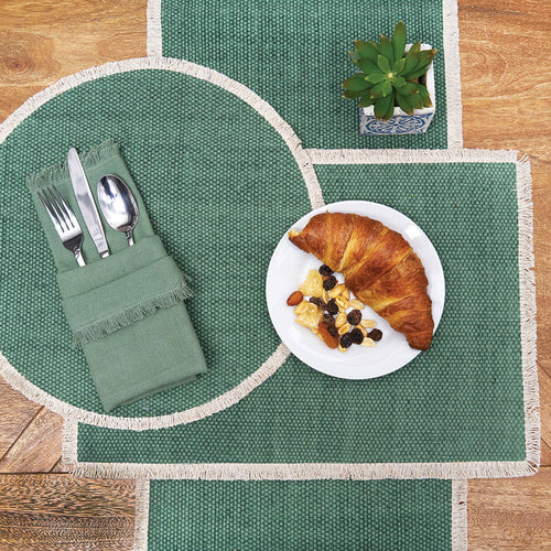 Fringed Table Linens table linens displayed as a coordinated tabletop setting.