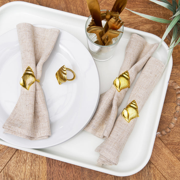 A Gold Conch Shell Napkin Ring, Set of 4.