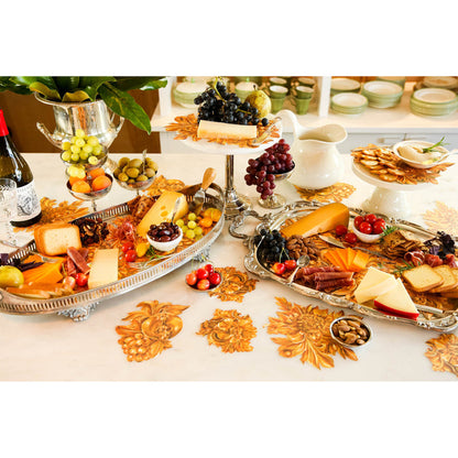 An elegant charcuterie spread featuring Gold Flora Serving Confetti scattered across the table.