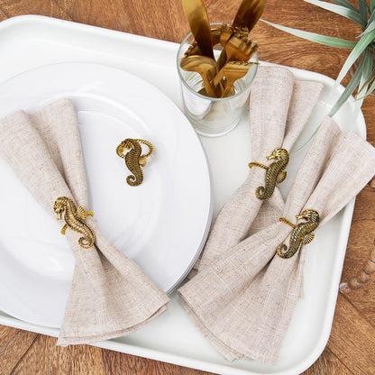 A Gold Seahorse Napkin Ring, Set of 4.