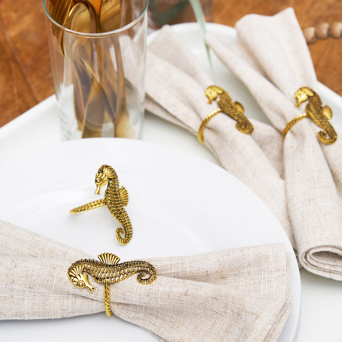 A Gold Seahorse Napkin Ring, Set of 4.