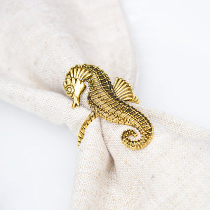 A Gold Seahorse Napkin Ring, Set of 4.