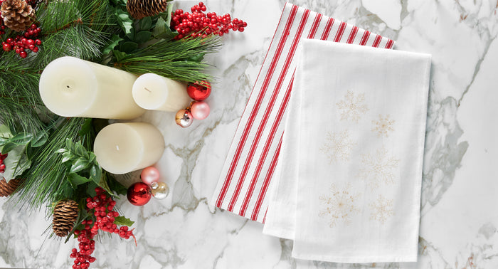 A Gold Snowflake Flour Sack Kitchen Towel.
