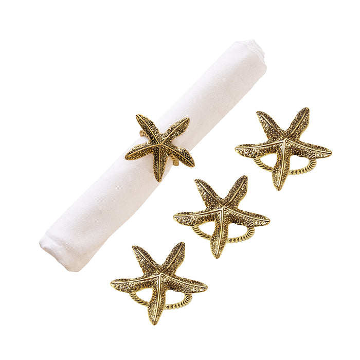 A Gold Starfish Napkin Ring, Set of 4.