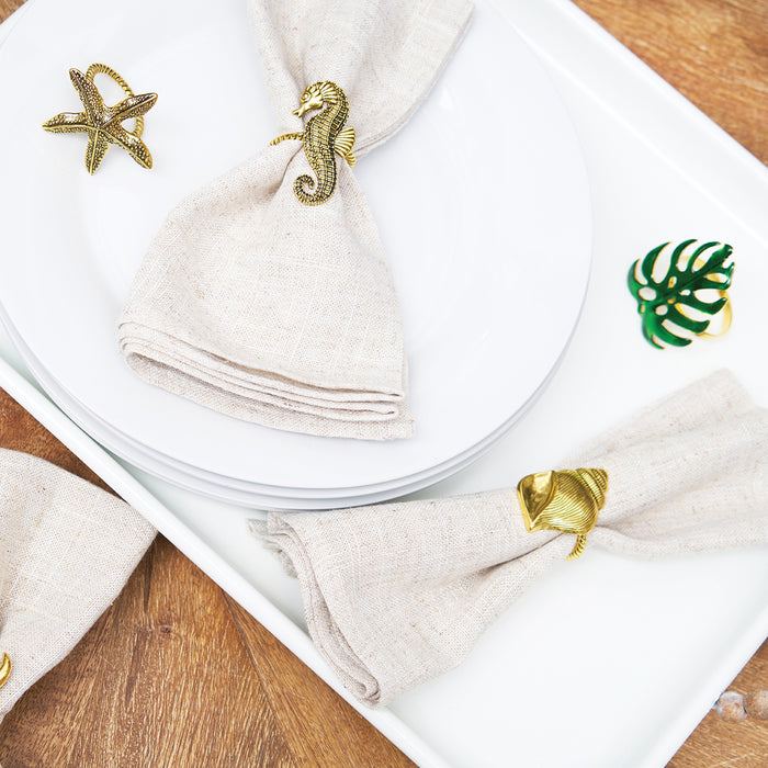 A Gold Starfish Napkin Ring, Set of 4.