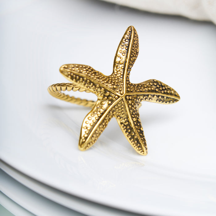 A Gold Starfish Napkin Ring, Set of 4.