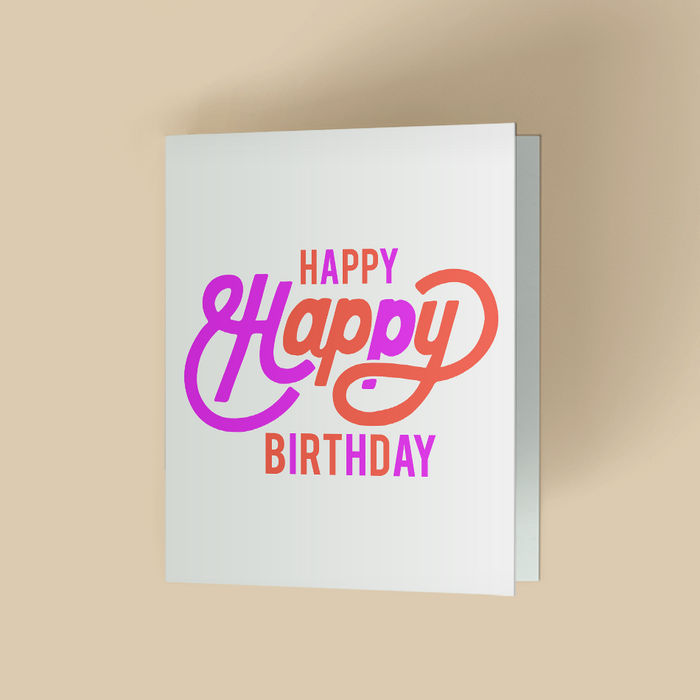 White folded birthday card featuring the words 'Happy Happy Birthday' in a bold, retro inspired script and block lettering with a purple-to-orange gradient on a clean white background.