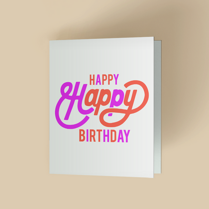 White folded birthday card featuring the words 'Happy Happy Birthday' in a bold, retro inspired script and block lettering with a purple-to-orange gradient on a clean white background.