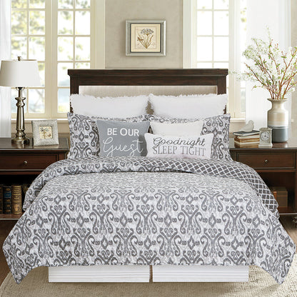 A Heather Quilt Set displayed on a made bed.