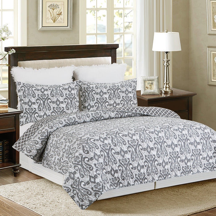 A Heather Quilt Set displayed on a made bed.