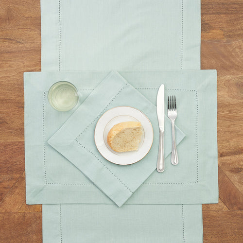 Hemstitch Table Linens table linens displayed as a coordinated tabletop setting.
