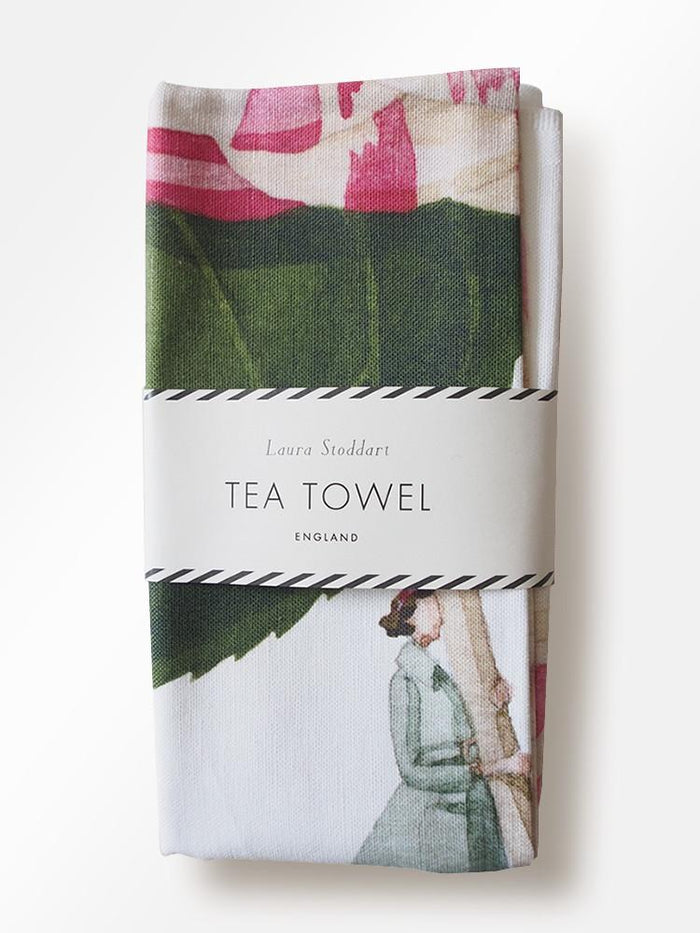 A In Bloom Camellia Linen Tea Towel by Hester & Cook featuring botanical illustrations of a woman holding a pink flower.