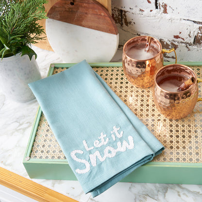 A let it snow woven towel.