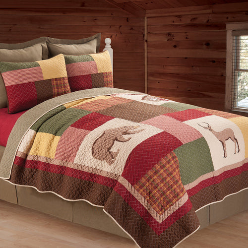 A Luke Quilt displayed on a made bed.
