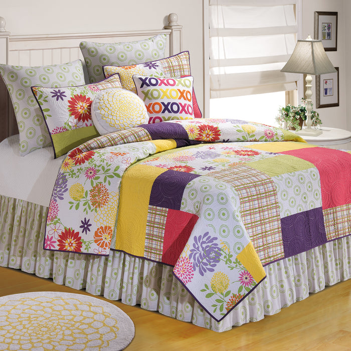 A Macie Quilt displayed on a made bed.