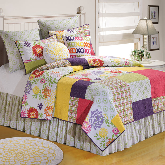 A Macie Quilt displayed on a made bed.