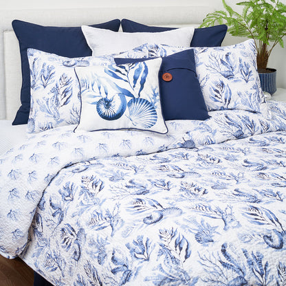 A Midnight Lagoon Quilt Set displayed on a made bed.