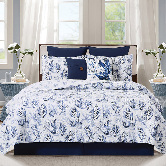 A Midnight Lagoon Quilt Set displayed on a made bed.