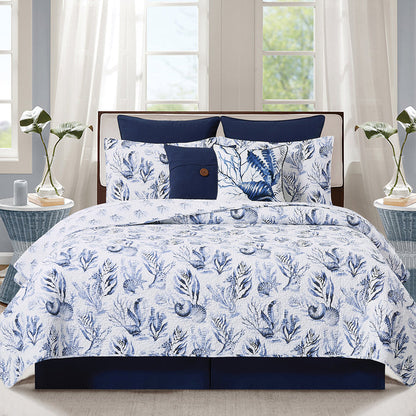 A Midnight Lagoon Quilt Set displayed on a made bed.