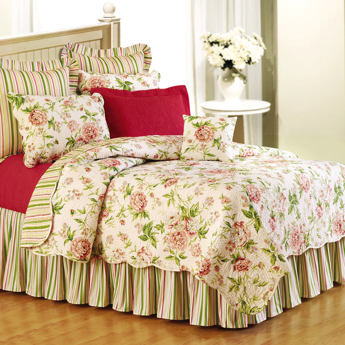 A Pink Brianna Quilt displayed on a made bed.