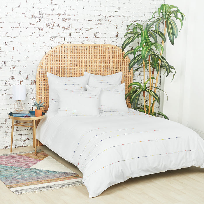 A raina duvet cover displayed on a bed.