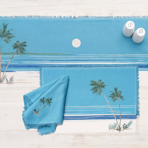 Retro Palms Table Linens table linens displayed as a coordinated tabletop setting.