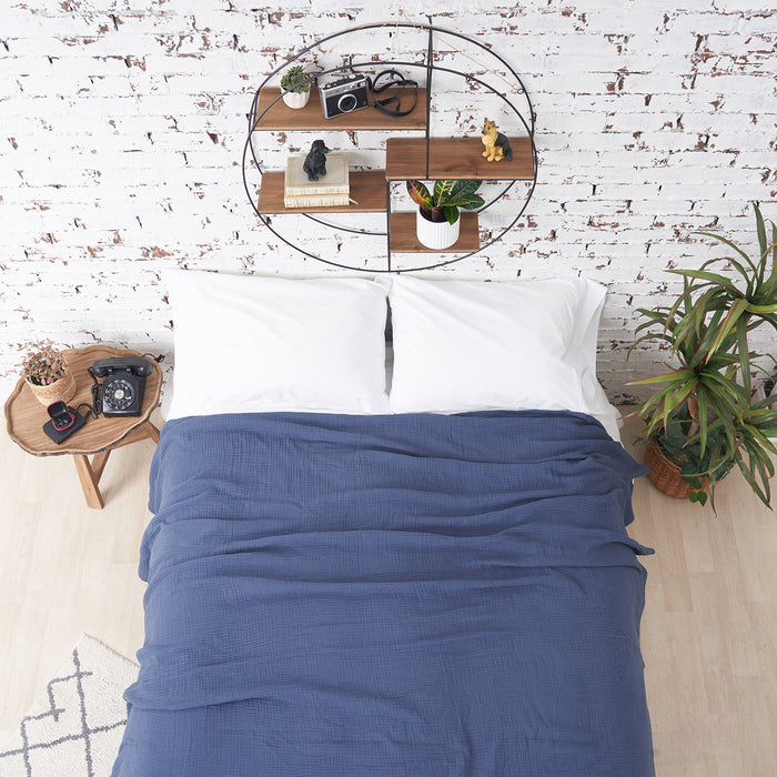 A ryker coverlet displayed on a bed.