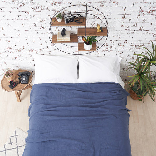A ryker coverlet displayed on a bed.
