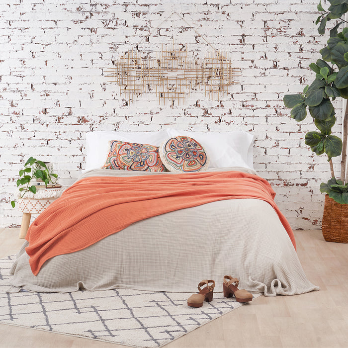 A ryker coverlet displayed on a bed.