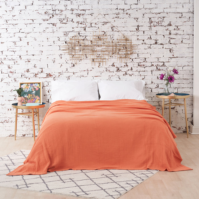 A ryker coverlet displayed on a bed.