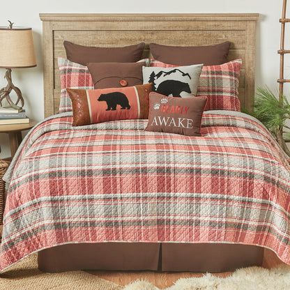 A Saffron Plaid Quilt Set displayed on a made bed.