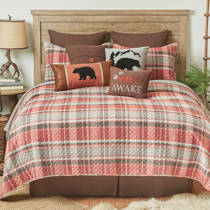 A Saffron Plaid Quilt Set displayed on a made bed.