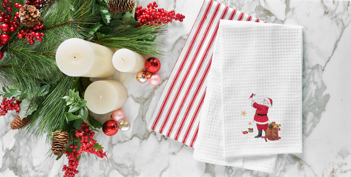 A Santa and Cardinal Waffle Weave Kitchen Towel.
