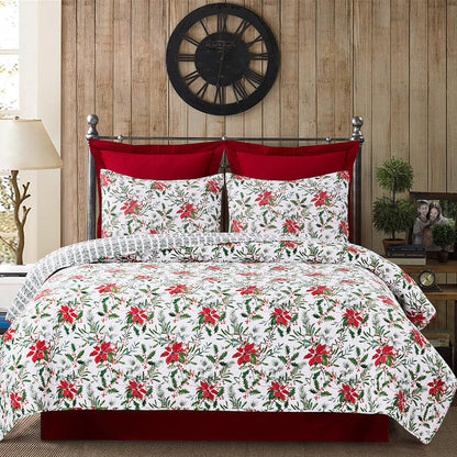 A Silvia Poinsettia Quilt Set displayed on a made bed.