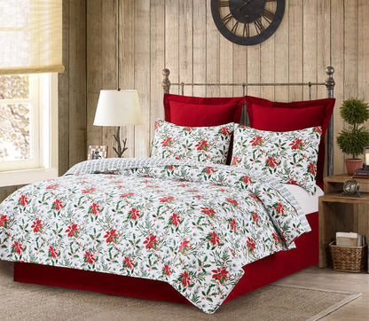 A Silvia Poinsettia Quilt Set displayed on a made bed.