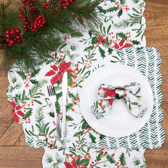 Silvia Poinsettia Table Linens table linens displayed as a coordinated tabletop setting.