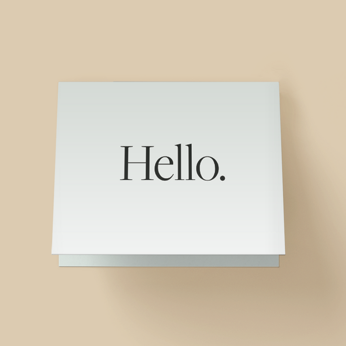 Minimalist card with white background. The word "Hello" in large, elegant black serif type, centered with period.