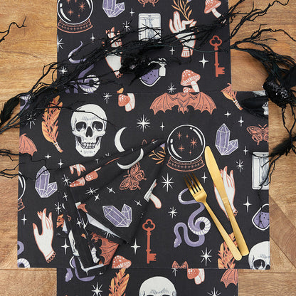 Spooky Magic Table Linens table linens displayed as a coordinated tabletop setting.