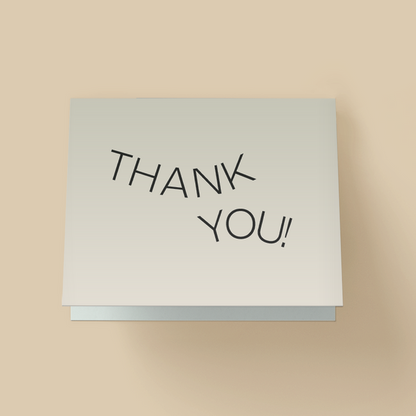 Minimalist thank you card with a white background. The words "THANK YOU" are in thin, black, uppercase sans-serif font, arranged in a slight upward arch in the center with a small plus sign accent in the top right corner.
